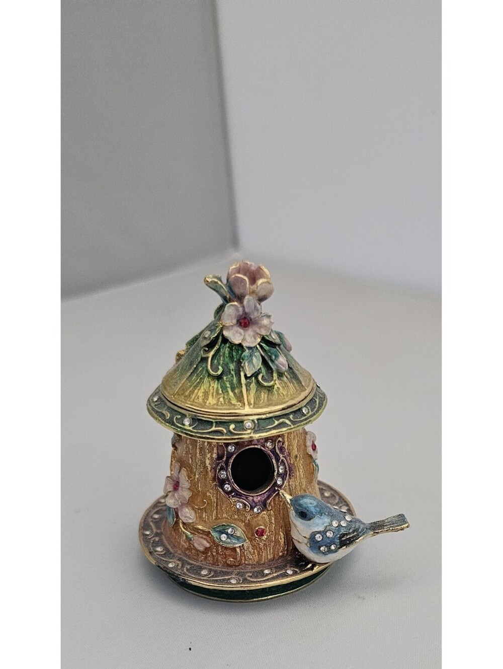 Kubla Crafts enameled trinket box with a bejeweled bluebird perched a birdhouse